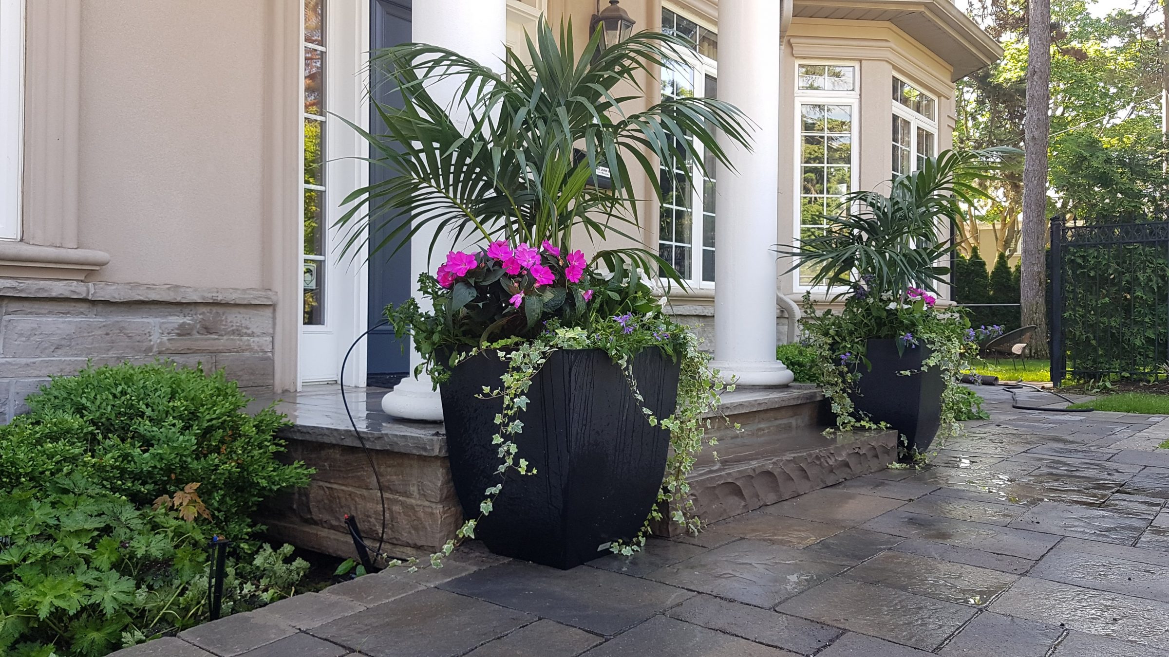 Elegant patio with potted plants and columns